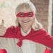 thumbs up masked older woman